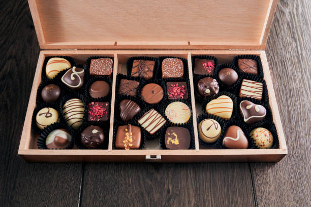 istock Assorted chocolate candies in wooden box. 1210142195