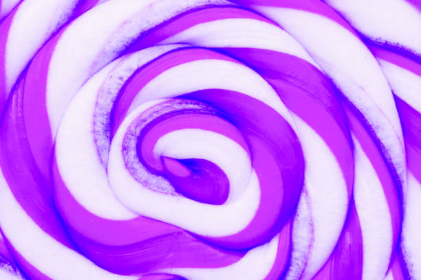 Purple Lollipop text, close up . Minimal concept with copy space. Confectionery, candy close-up, macro, texture