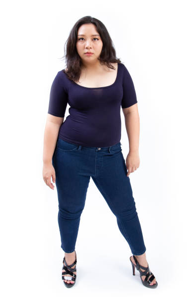 istock beautiful fat woman plus size model standing pose on white background 1210146988
