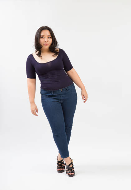 istock beautiful fat woman plus size model standing pose on white background 1210147011