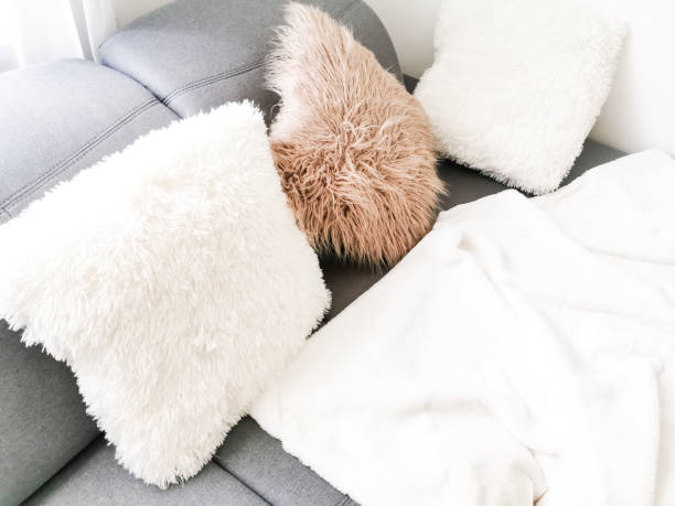 istock white pillows on a gray sofa background decoration 1210152090