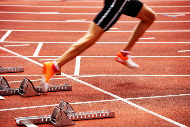istock Sportsman start running on stadium track sprint 1210155273
