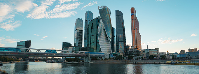 Moscow, Russia - August 17, 2018: Moscow City Towers in summer day. Moscow city structure: modern buildings of MIBC (Moscow International Business Center), bridge, Moskva river. Panoramic photography