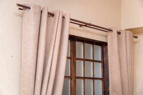 Light curtainsin front of the window in the room