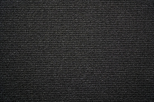 Black background carpeting with small horizontal stripes