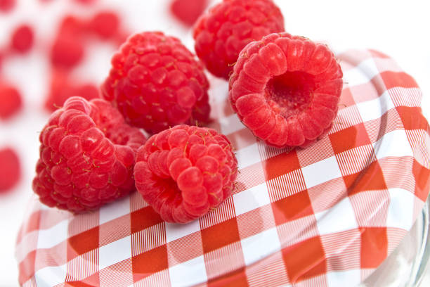 istock Raspberries and  jar close up 1210157682