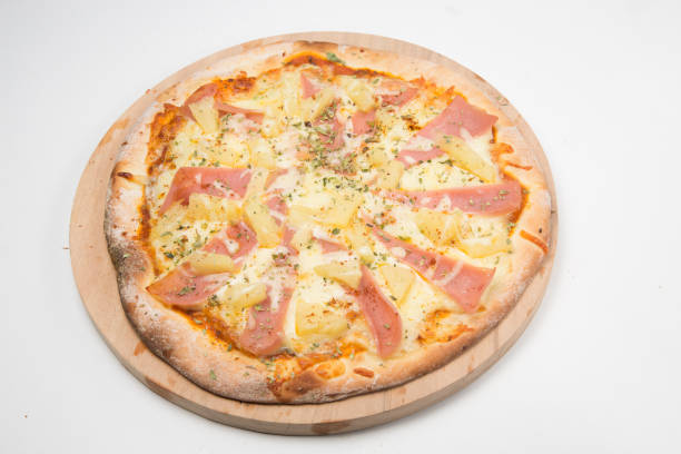 istock Round pizza served on a wooden board 1210158461