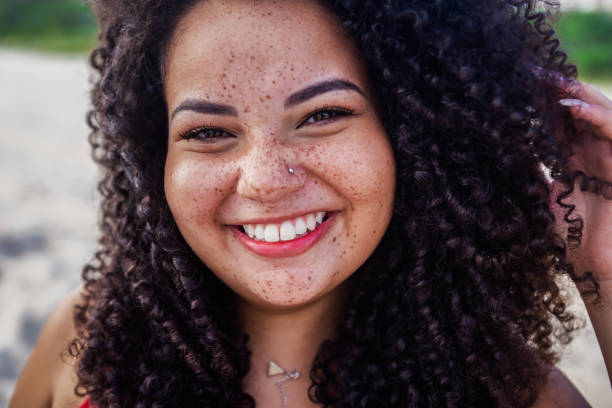 istock Laughing girl at beach 1210158561