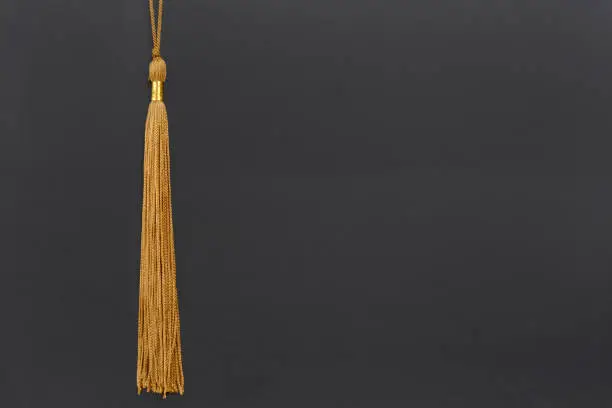 Photo of gold graduation tassel