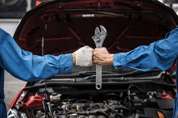 istock Fist and mechanics hand with tool. 1210159968