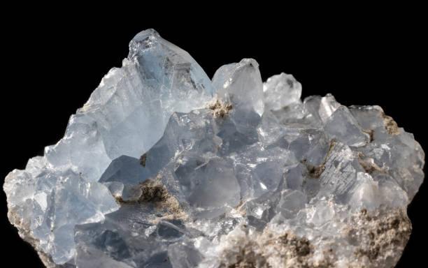 istock Blue celestine mineral macro close-up against black 1210161496
