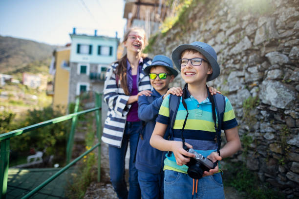 istock Three little tourists sightseeing Corniglia in Cinque Terre, Italy 1210162342