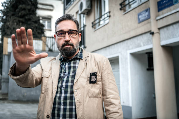 istock Mature detective with police badge 1210164765