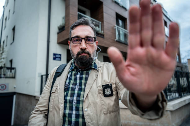 istock Mature detective with police badge 1210165144