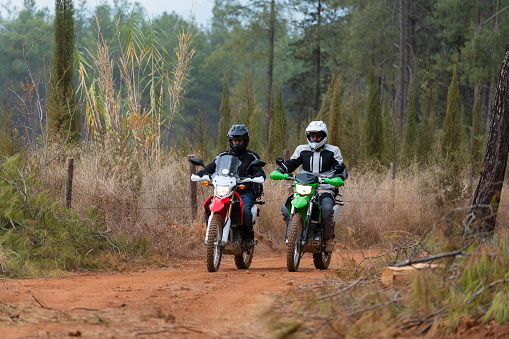 Motorbikes on dirt road