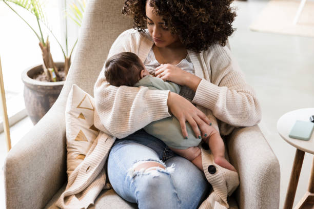 istock New mom breastfeeds her baby boy 1210165424