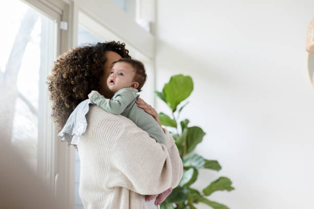 istock New mom holds her newborn baby boy 1210165442