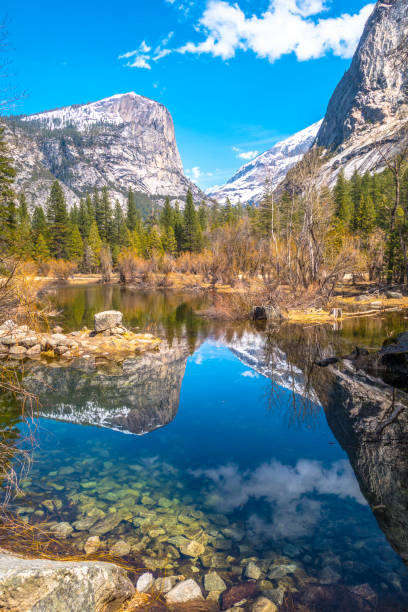 Beautiful reflection of mountains in Mirror Lake in Yosemite National Park Summer scene of beautiful reflection of mountains in Mirror Lake in Yosemite National Park. Royalty free stock photo. mirror lake stock pictures, royalty-free photos & images