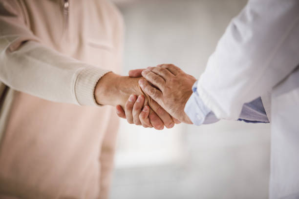 istock Doctor and patient handshake 1210167850