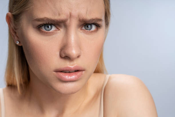 istock Attractive low-spirited blonde female posing for the camera 1210168560