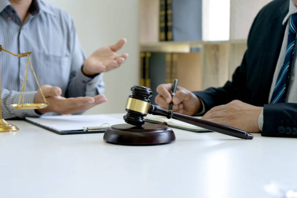 istock Judge or lawyer talking  with team or client 1210169606