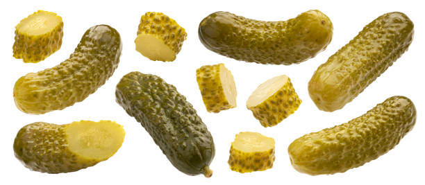istock Pickled gherkins, marinated cucumbers isolated on white background 1210170366