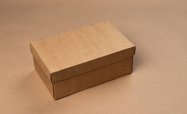 istock Brown cardboard box on craft paper background 1210170672