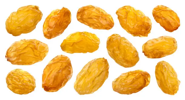 Yellow raisins isolated on white background with clipping path, close up