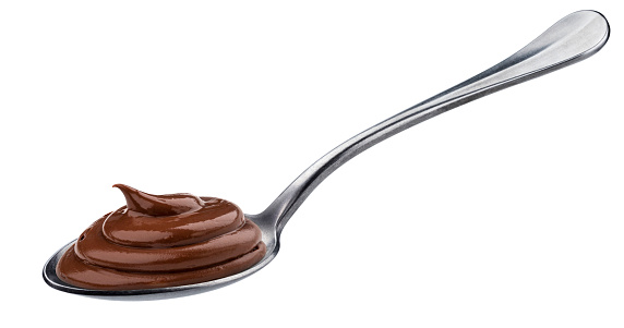 Swirl of chocolate cream in spoon isolated on white background with clipping path