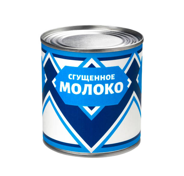 istock Condensed milk can isolated on white background, russian cyrillic text 1210171105