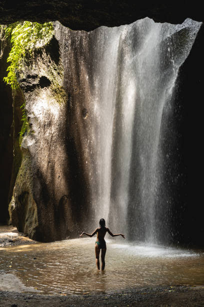 istock Relaxed young female person standing in water 1210172505