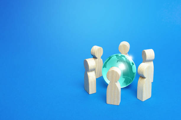 istock Blue earth globe is surrounded by people. Global communication, cooperation and collaboration. Diplomacy and negotiation process. Access to the World Wide Web. Consolidation in solving global problems 1210173355