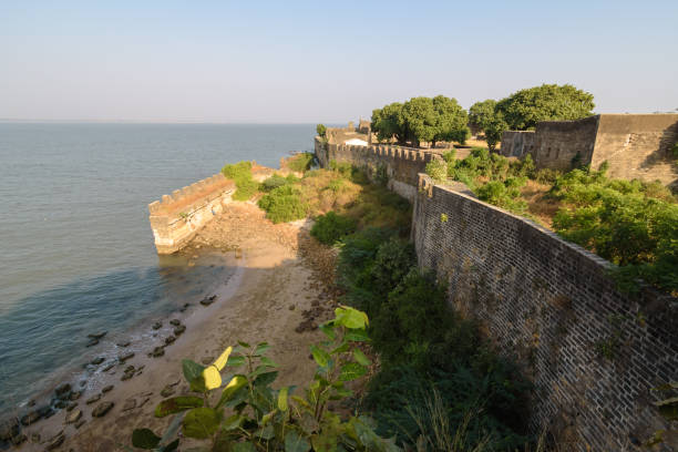 Diu #12 Diu, India - November 2018: The exterior ramparts and facade of the colonial architecture of the Portuguese era fort in Diu Island. diu island stock pictures, royalty-free photos & images