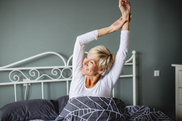 istock Senior woman waking up 1210174233