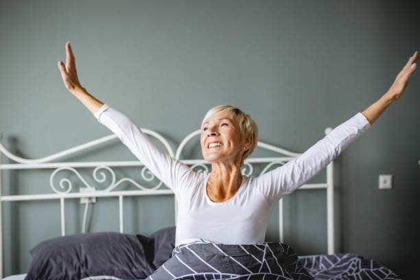 istock Senior woman waking up 1210174279