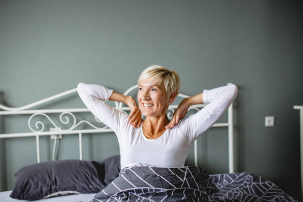 istock Senior woman waking up 1210174615