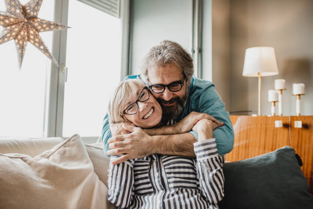 istock Loving seniors embracing at home 1210175196