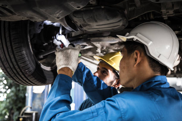 istock Two mechanic was checking the car suspension. 1210175210