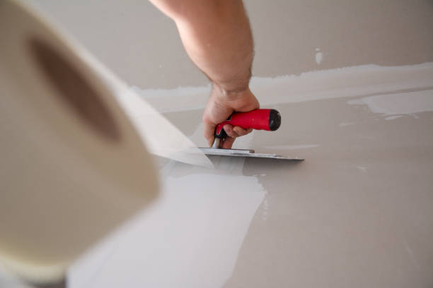 istock Preparing for painting wall. Close Up 1210176314