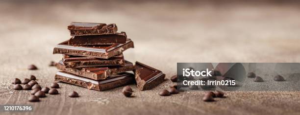 Closeup Of Chocolate Pieces Stock Photo - Download Image Now - Chocolate, Chocolate Pieces, Dark Chocolate