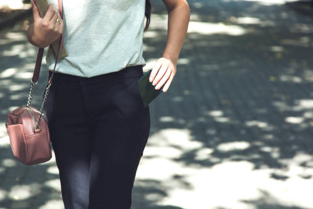 istock woman hand phone in pocket 1210177008