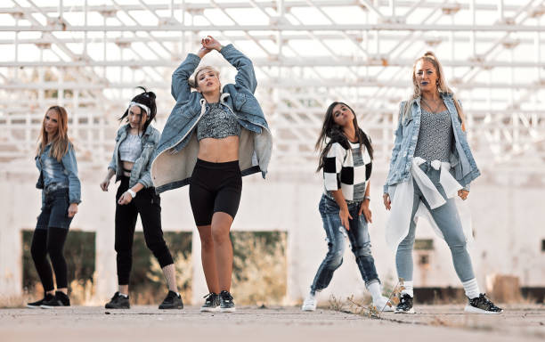 istock Young woman dancing outdoors 1210178857