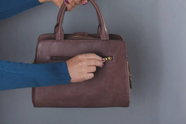 istock woman hand bag 1210179046