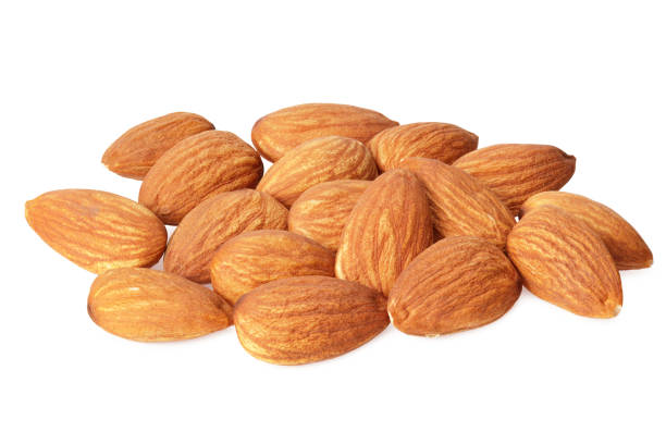 istock almond isolated on white background. Nuts on white background. 1210179892