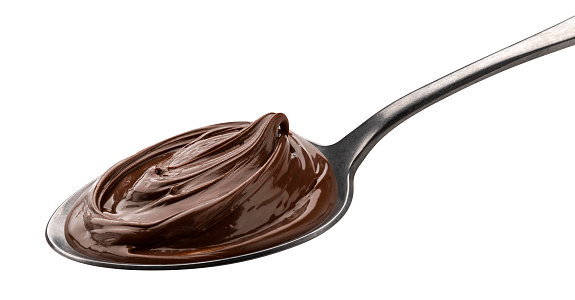 Chocolate cream in spoon isolated on white background with clipping path