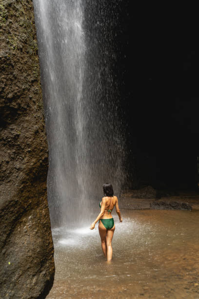istock Young brunette woman being inside of cave 1210180278