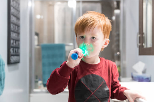 istock Little Redhead Boy Brushing His Teeth 1210180722