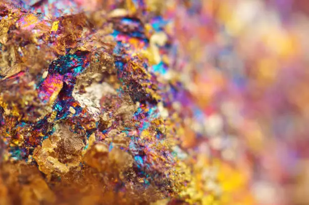 Photo of Non-ferrous metal. Nugget. Gold.Copper. Iron. Macro. Colorful background.