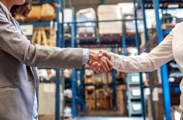 istock Warehouse manager shaking hand with colleague 1210182419