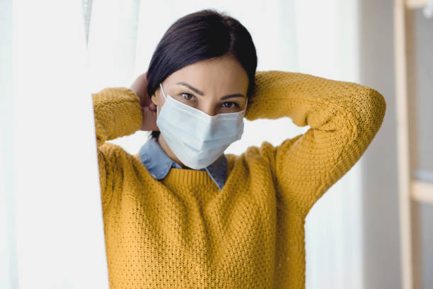 istock Asian Woman wearing disposable face mask 1210183313